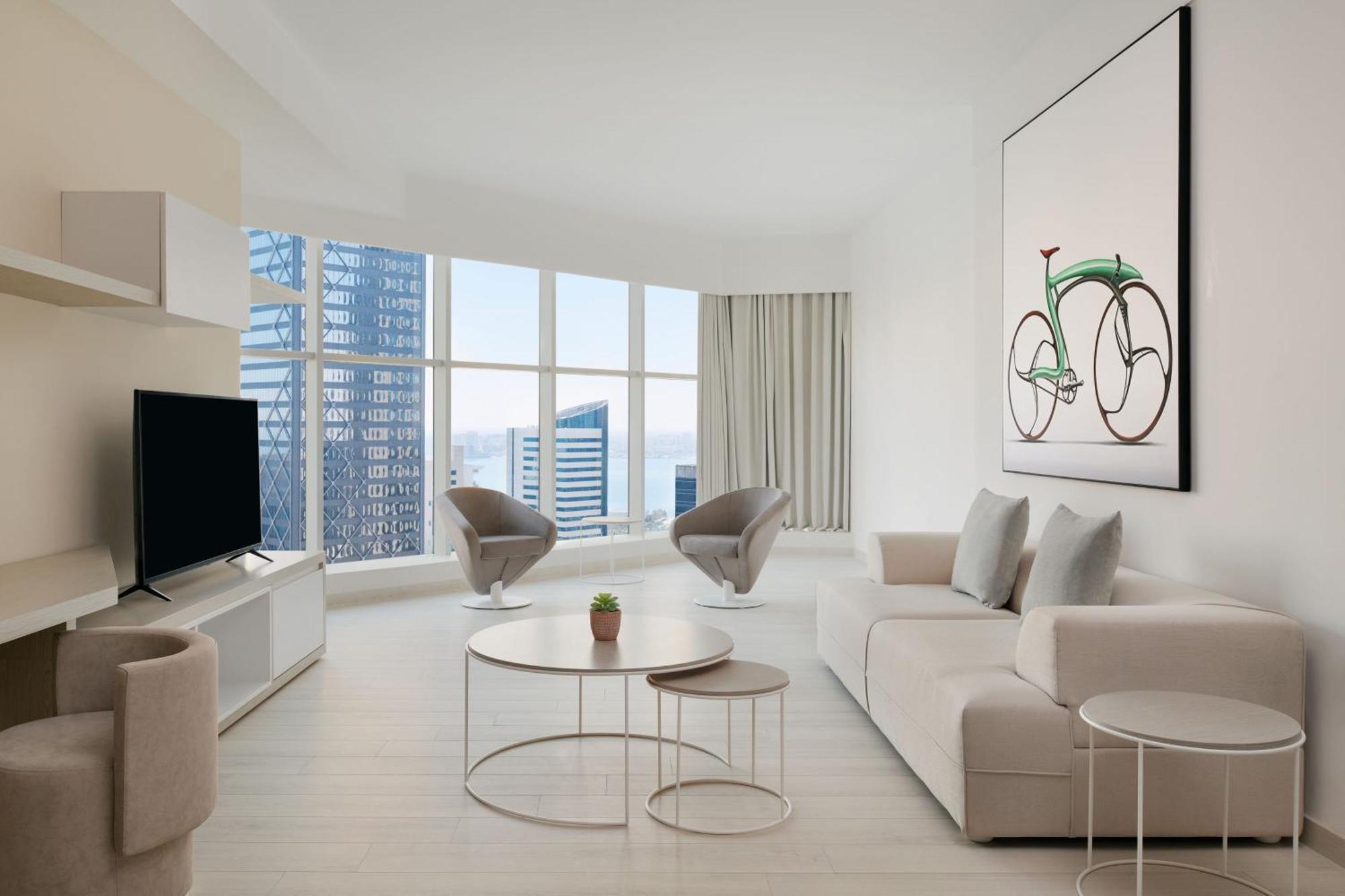 Element By Westin West Bay Doha Hotel Bagian luar foto A living room in a condominium
