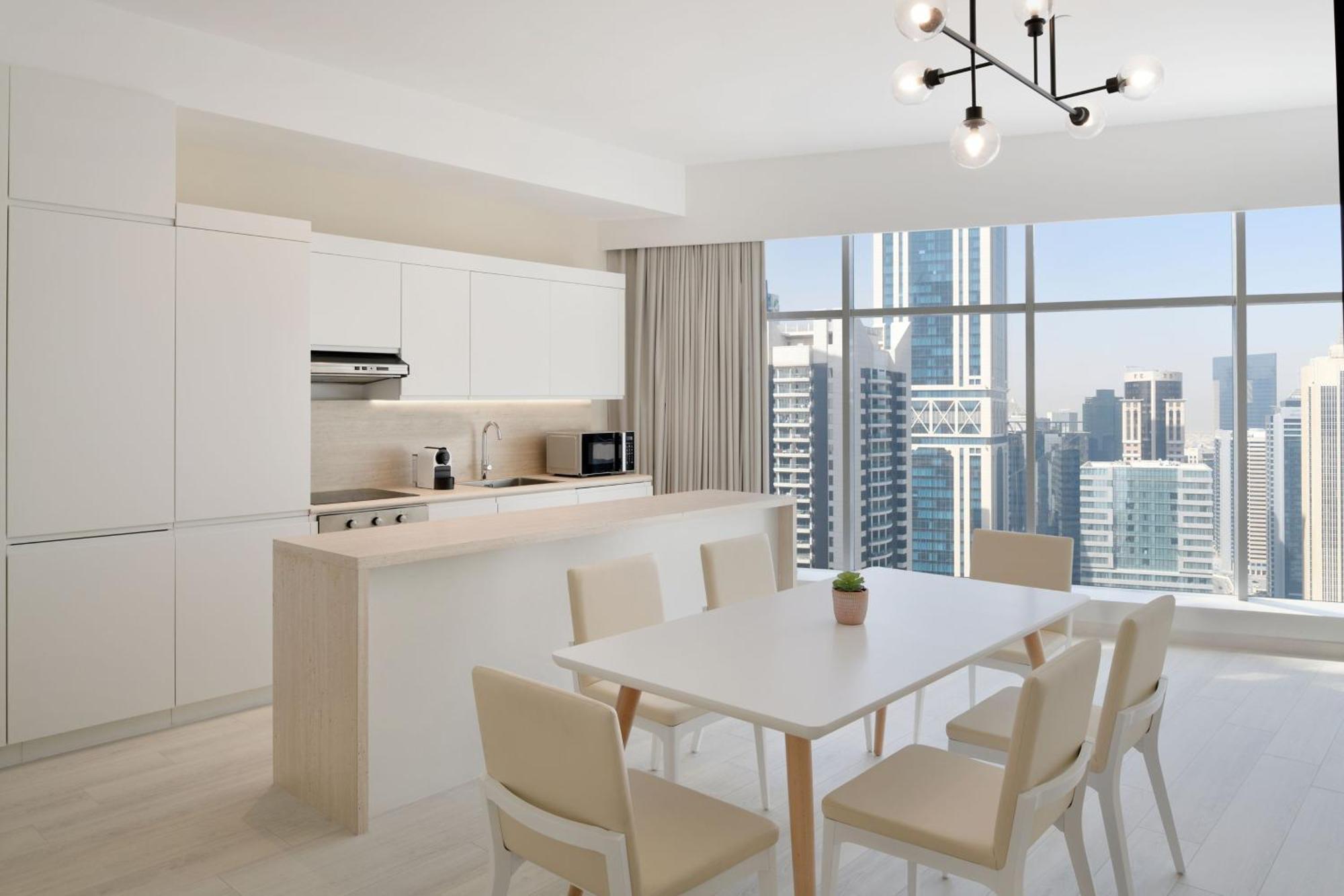 Element By Westin West Bay Doha Hotel Bagian luar foto A kitchen in a typical apartment